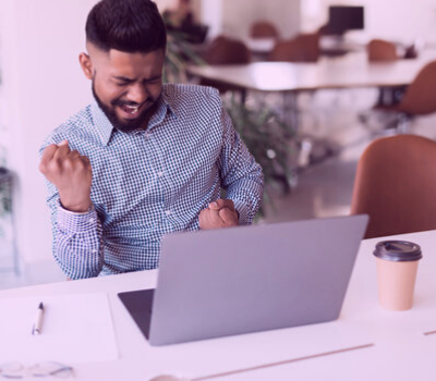 man showing excitement at the computer